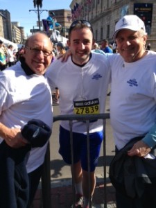 Gary Fox and Dick Vitale congratulate Mike at the finish line